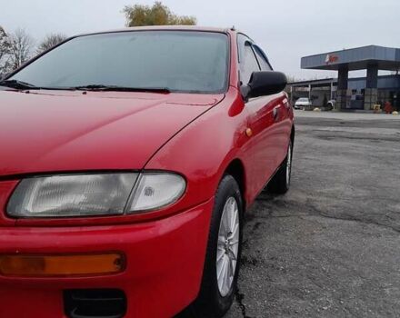 Червоний Мазда 323, об'ємом двигуна 1.49 л та пробігом 290 тис. км за 2800 $, фото 4 на Automoto.ua
