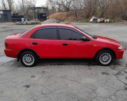 Червоний Мазда 323, об'ємом двигуна 1.5 л та пробігом 290 тис. км за 2800 $, фото 1 на Automoto.ua