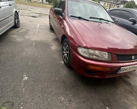 Красный Мазда 323, объемом двигателя 1.5 л и пробегом 295 тыс. км за 2500 $, фото 1 на Automoto.ua