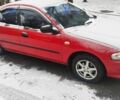 Красный Мазда 323, объемом двигателя 1.5 л и пробегом 381 тыс. км за 1450 $, фото 1 на Automoto.ua
