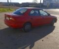 Красный Мазда 323, объемом двигателя 1.5 л и пробегом 244 тыс. км за 2000 $, фото 1 на Automoto.ua