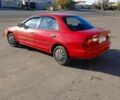 Красный Мазда 323, объемом двигателя 1.5 л и пробегом 244 тыс. км за 2000 $, фото 1 на Automoto.ua