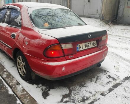 Красный Мазда 323, объемом двигателя 1.5 л и пробегом 381 тыс. км за 1450 $, фото 2 на Automoto.ua
