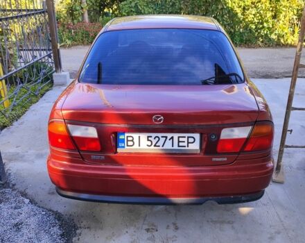 Красный Мазда 323, объемом двигателя 1 л и пробегом 315 тыс. км за 1800 $, фото 3 на Automoto.ua