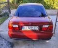 Красный Мазда 323, объемом двигателя 1 л и пробегом 315 тыс. км за 1800 $, фото 3 на Automoto.ua