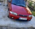 Красный Мазда 323, объемом двигателя 1 л и пробегом 315 тыс. км за 1800 $, фото 1 на Automoto.ua