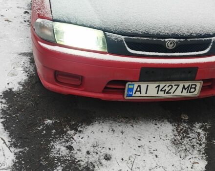 Красный Мазда 323, объемом двигателя 1.5 л и пробегом 381 тыс. км за 1450 $, фото 1 на Automoto.ua