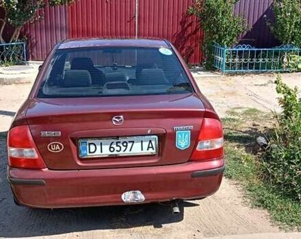 Червоний Мазда 323, об'ємом двигуна 1.5 л та пробігом 321 тис. км за 2500 $, фото 1 на Automoto.ua