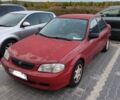 Красный Мазда 323, объемом двигателя 1.6 л и пробегом 203 тыс. км за 1805 $, фото 1 на Automoto.ua