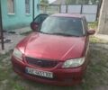 Красный Мазда 323, объемом двигателя 1.6 л и пробегом 329 тыс. км за 2000 $, фото 1 на Automoto.ua