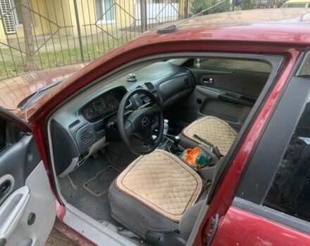 Червоний Мазда 323, об'ємом двигуна 2 л та пробігом 167 тис. км за 2400 $, фото 2 на Automoto.ua