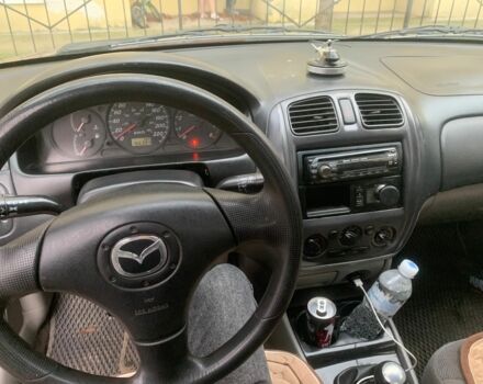 Червоний Мазда 323, об'ємом двигуна 2 л та пробігом 167 тис. км за 2400 $, фото 1 на Automoto.ua