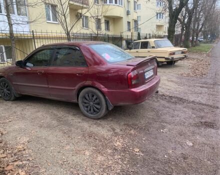 Червоний Мазда 323, об'ємом двигуна 2 л та пробігом 167 тис. км за 2400 $, фото 4 на Automoto.ua