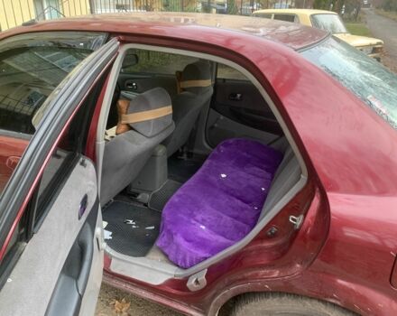 Червоний Мазда 323, об'ємом двигуна 2 л та пробігом 167 тис. км за 2400 $, фото 5 на Automoto.ua