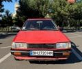 Красный Мазда 323, объемом двигателя 1.5 л и пробегом 255 тыс. км за 800 $, фото 1 на Automoto.ua