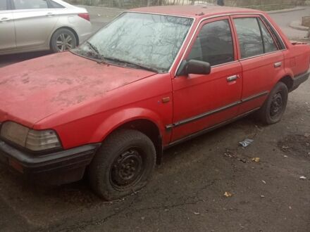 Красный Мазда 323, объемом двигателя 1.3 л и пробегом 300 тыс. км за 500 $, фото 1 на Automoto.ua