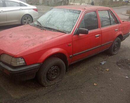 Красный Мазда 323, объемом двигателя 1.3 л и пробегом 300 тыс. км за 500 $, фото 1 на Automoto.ua