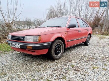 Червоний Мазда 323, об'ємом двигуна 1.3 л та пробігом 250 тис. км за 950 $, фото 1 на Automoto.ua
