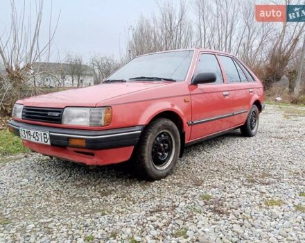 Красный Мазда 323, объемом двигателя 1.3 л и пробегом 250 тыс. км за 950 $, фото 1 на Automoto.ua
