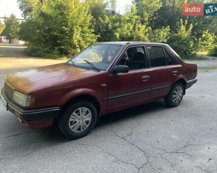 Червоний Мазда 323, об'ємом двигуна 1.3 л та пробігом 450 тис. км за 900 $, фото 1 на Automoto.ua