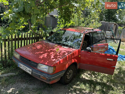Красный Мазда 323, объемом двигателя 1.5 л и пробегом 254 тыс. км за 900 $, фото 1 на Automoto.ua