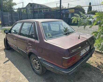 Красный Мазда 323, объемом двигателя 1.5 л и пробегом 138 тыс. км за 250 $, фото 1 на Automoto.ua