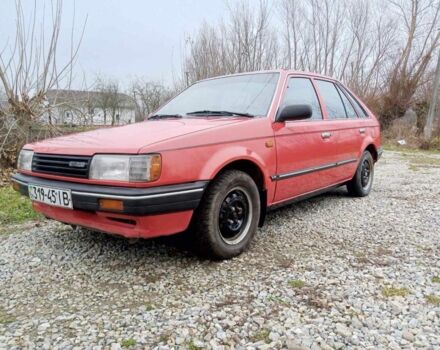 Красный Мазда 323, объемом двигателя 1.3 л и пробегом 250 тыс. км за 950 $, фото 1 на Automoto.ua