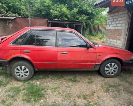 Красный Мазда 323, объемом двигателя 1 л и пробегом 70 тыс. км за 428 $, фото 1 на Automoto.ua