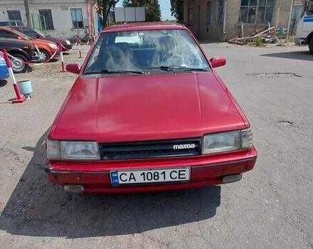 Красный Мазда 323, объемом двигателя 1.5 л и пробегом 245 тыс. км за 650 $, фото 1 на Automoto.ua