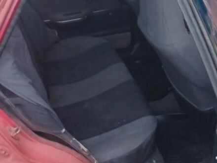 Красный Мазда 323, объемом двигателя 1.3 л и пробегом 2 тыс. км за 952 $, фото 1 на Automoto.ua