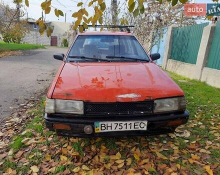 Красный Мазда 323, объемом двигателя 1.5 л и пробегом 225 тыс. км за 800 $, фото 1 на Automoto.ua