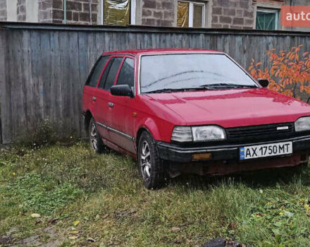 Красный Мазда 323, объемом двигателя 1.49 л и пробегом 350 тыс. км за 900 $, фото 1 на Automoto.ua