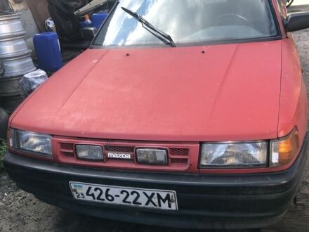 Красный Мазда 323, объемом двигателя 1.7 л и пробегом 323 тыс. км за 700 $, фото 1 на Automoto.ua