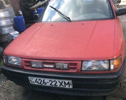 Красный Мазда 323, объемом двигателя 1.7 л и пробегом 323 тыс. км за 700 $, фото 1 на Automoto.ua