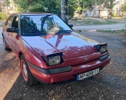 Красный Мазда 323, объемом двигателя 1.8 л и пробегом 444 тыс. км за 1200 $, фото 1 на Automoto.ua