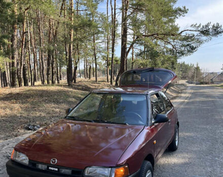 Красный Мазда 323, объемом двигателя 1.3 л и пробегом 400 тыс. км за 2000 $, фото 1 на Automoto.ua
