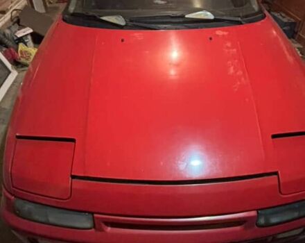 Червоний Мазда 323, об'ємом двигуна 1.8 л та пробігом 150 тис. км за 750 $, фото 1 на Automoto.ua