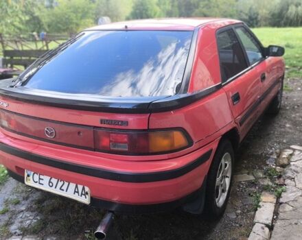 Красный Мазда 323, объемом двигателя 1 л и пробегом 317 тыс. км за 1100 $, фото 1 на Automoto.ua