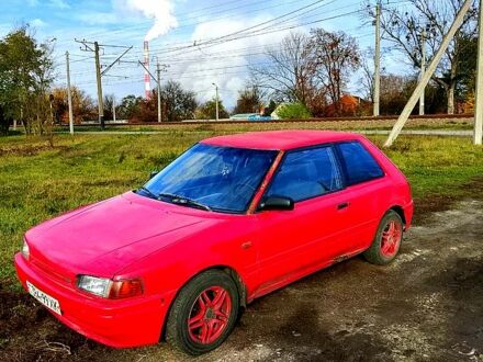Червоний Мазда 323, об'ємом двигуна 1.6 л та пробігом 210 тис. км за 700 $, фото 1 на Automoto.ua