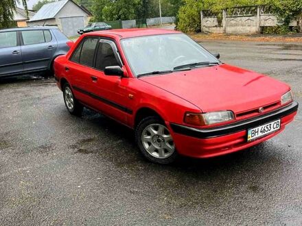 Красный Мазда 323, объемом двигателя 1.6 л и пробегом 240 тыс. км за 1200 $, фото 1 на Automoto.ua
