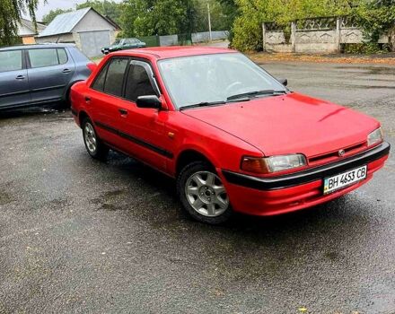 Красный Мазда 323, объемом двигателя 1.6 л и пробегом 240 тыс. км за 1200 $, фото 1 на Automoto.ua