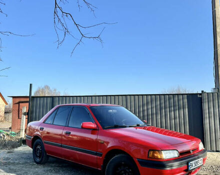 Красный Мазда 323, объемом двигателя 1.6 л и пробегом 215 тыс. км за 2099 $, фото 1 на Automoto.ua