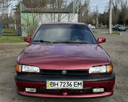 Красный Мазда 323, объемом двигателя 1.6 л и пробегом 350 тыс. км за 1200 $, фото 1 на Automoto.ua
