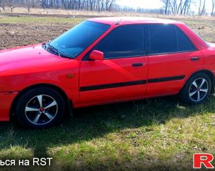 Красный Мазда 323, объемом двигателя 1.3 л и пробегом 0 тыс. км за 950 $, фото 1 на Automoto.ua