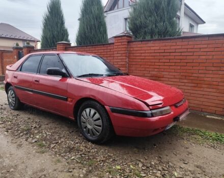 Красный Мазда 323, объемом двигателя 6 л и пробегом 130 тыс. км за 1500 $, фото 1 на Automoto.ua