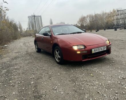 Красный Мазда 323, объемом двигателя 1.5 л и пробегом 323 тыс. км за 1100 $, фото 1 на Automoto.ua