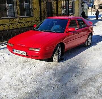 Красный Мазда 323, объемом двигателя 1.6 л и пробегом 322 тыс. км за 2100 $, фото 1 на Automoto.ua