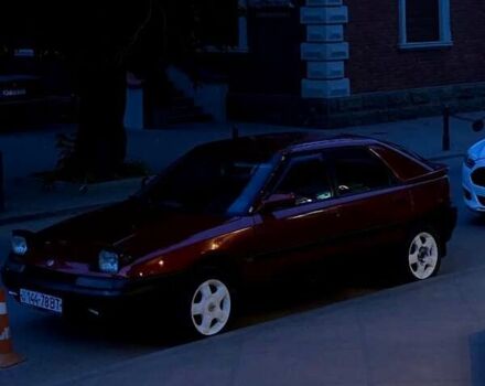 Красный Мазда 323, объемом двигателя 1.6 л и пробегом 429 тыс. км за 1900 $, фото 1 на Automoto.ua