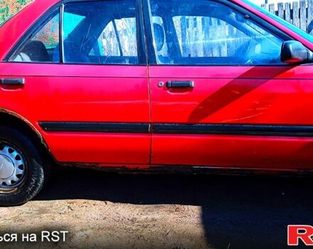 Червоний Мазда 323, об'ємом двигуна 1.7 л та пробігом 450 тис. км за 1000 $, фото 1 на Automoto.ua