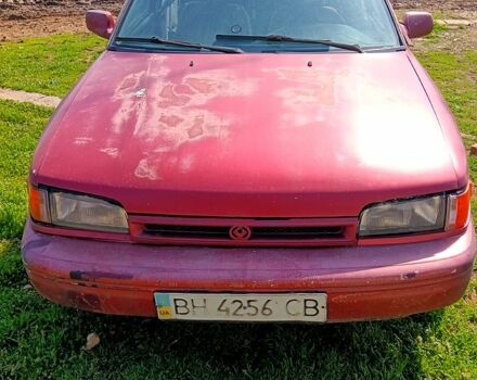 Красный Мазда 323, объемом двигателя 2 л и пробегом 111 тыс. км за 500 $, фото 1 на Automoto.ua